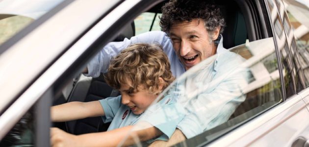 Father and son driving car stage