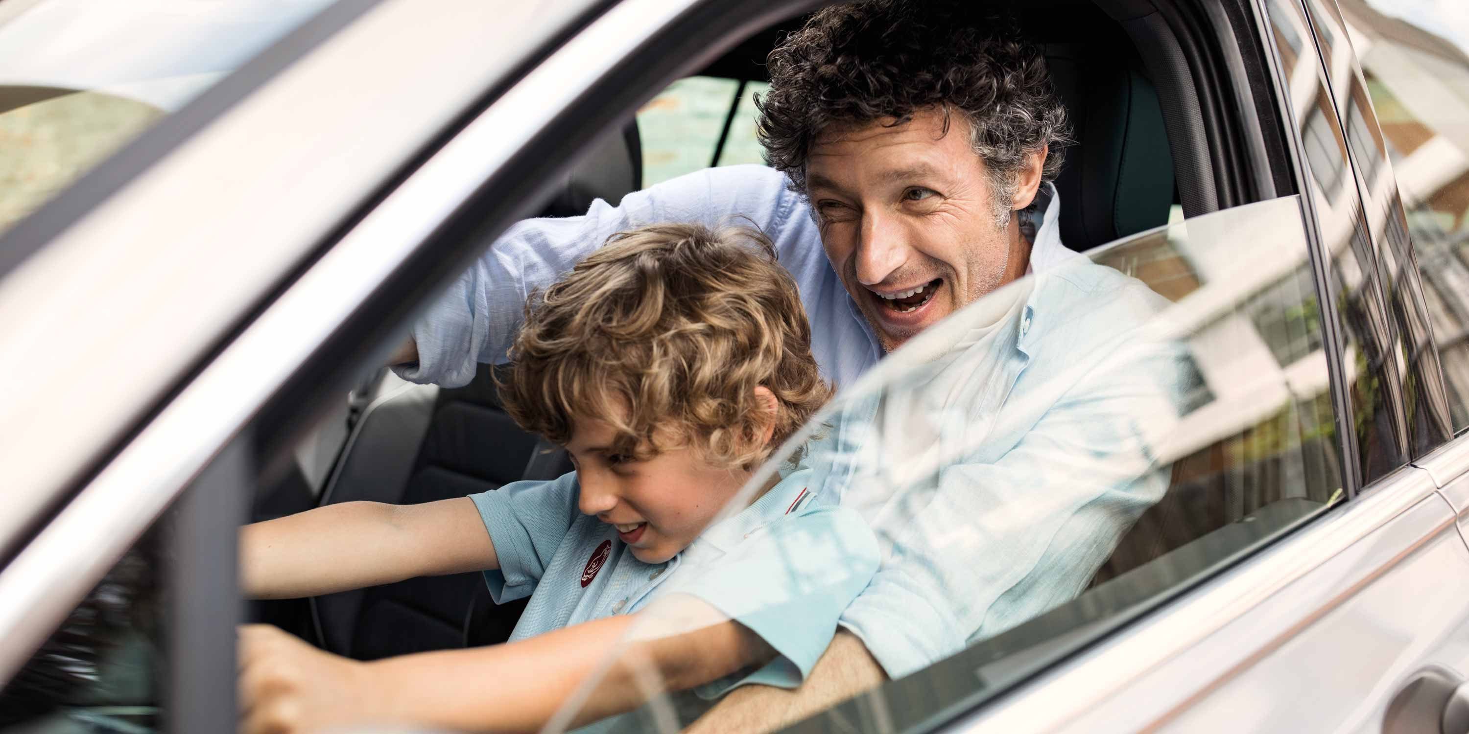 Father and son driving car stage